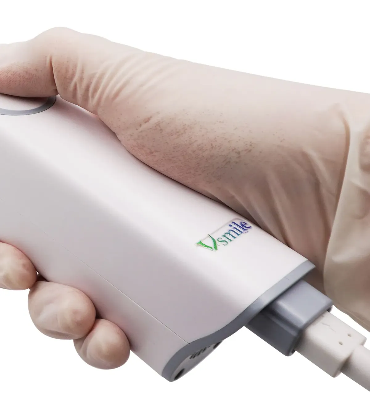 Scanner handpiece held in a gloved hand, with the cable at the rear