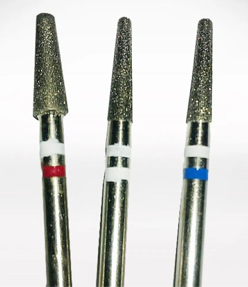 Three tapered burs with coloured rings on the shank
